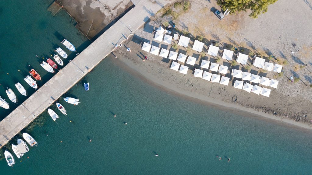 Enjoy waterfront views, mooring buoys, and a sandy beach with umbrellas.