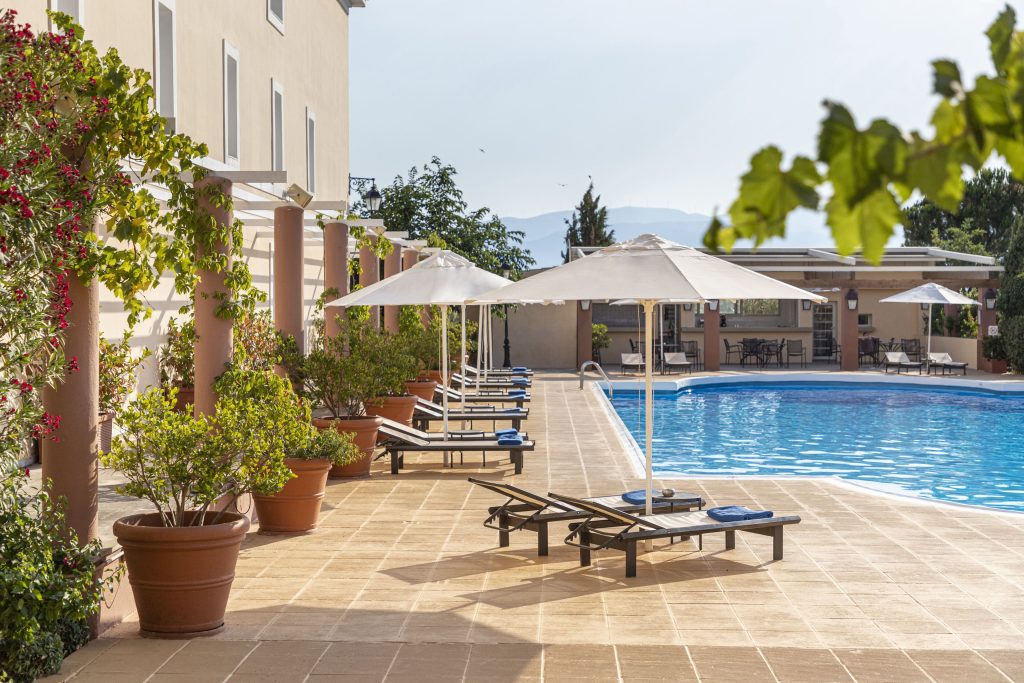 Seasonal outdoor pool, pool umbrellas, pool loungers Amalia Hotel